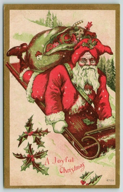 Christmas~Santa Rides Downhill on Toboggan~Toy Sack Back~Red Green~Gold Leaf 