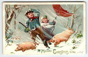 Christmas Postcard Pigs Boy Girl Blowing Wind Snow Umbrellas Tuck Series 102