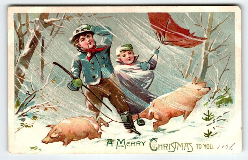 Christmas Postcard Pigs Boy Girl Blowing Wind Snow Umbrellas Tuck Series 102