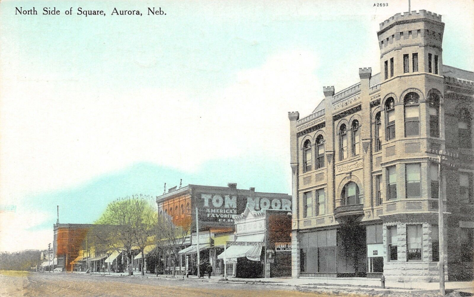 Aurora Nebraska North Side Square Corner Bank Woodard Drug Tom Moore Cigar 1910 Hippostcard