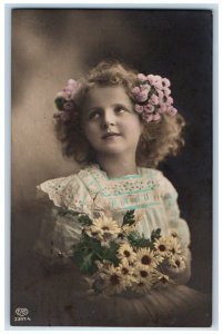 1913 Little Girl With Daisy Flowers Studio Portrait EAS RPPC Photo Postcard