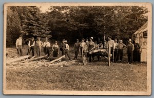 Postcard RPPC c1910s Group Of Men Hewing Logs Wood Large Gathering