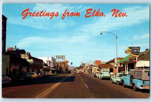 c1960 Nevada NV Vintage Postcard Greetings Elko Cafes Motels Casinos Street Car