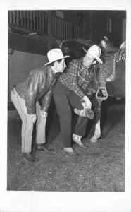 Cowboy Gene Autry Fuzzy Knight inspecting horse Shoe 1940s RPPC Postcard Howard