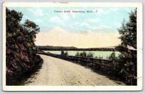 1920's County Road Ishpeming Michigan Rodway Cliff Fenced Ocean Posted Postcard