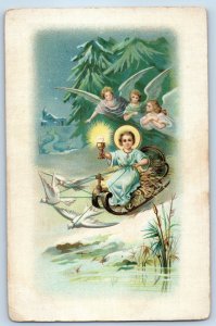 c1910's Christmas Religious Riding Sled Cherub Angels Winter Scene Postcard