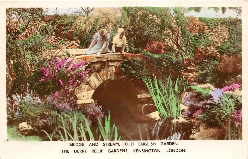 B85462 bridge and stream old english garden kensington   london uk