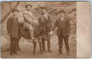 c1910s Hot Springs, AK Man Rides Donkey RPPC Gentlemen Bowler Photo Eureka A156