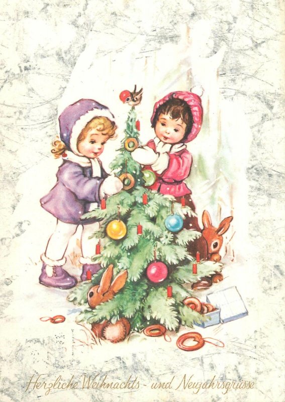 Sisters decorating Christmas tree Postcard