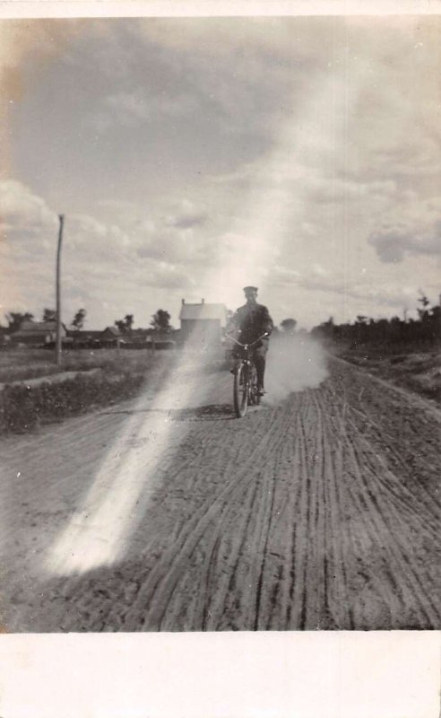 Man Riding Bicycle on Dirt Road Real Photo Vintage Postcard AA64596