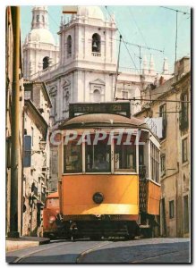 Postcard Modern Tramcar in an old quarter of Lisbon