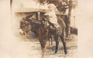 Child on a donkey Child, People Photo Unused 