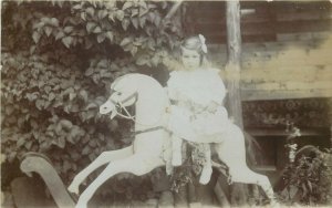 Girl rocking horse vintage real photo postcard