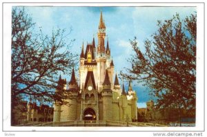 Evening sets on towering Cinderella Castle, Walt Disney World, 40-60s