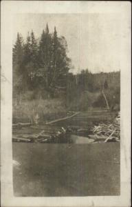 Logs in River 1919 Oakfield ME Cancel Real Photo Postcard