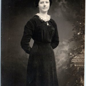 c1910s Pale Young Lady RPPC Cute Girl Smirk Black Dress Real Photo Corset A185