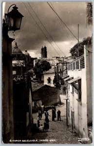 Taxco Mexico 1950s RPPC Real Photo Postcard Tipica Callejuela Street Scene
