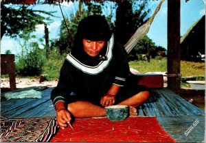 VINTAGE CONTINENTAL SIZE POSTCARD PERUVIAN SHIPIBO WOMAN PAINTING HER FABRICS