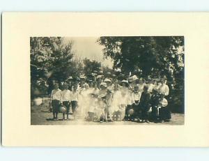 Pre-1918 rppc LOTS OF PEOPLE IN FORMAL CLOTHES IN GROUP SHOT r6064