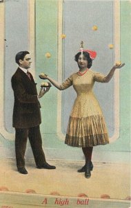 c1910 Postcard 698/17, A High Ball, Woman Juggling Balances Knife on her Nose