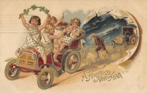 new years babies in new car old man pulling broke down car Postcard c1908