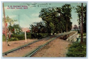 1910 P.M. Railroad Bridge Park Trees River Lake Lowell Michigan Vintage Postcard 