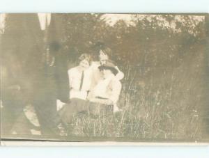 Pre-1920's rppc THREE WOMEN SITTING IN THE TALL GRASS o2243