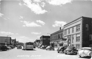 Postcard 1950s RPPC Iowa Garner Street Scene Bus automobiles 23-13565