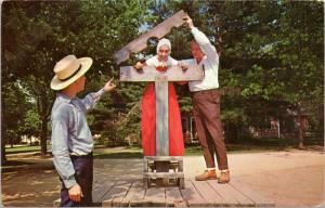 Old Sturbridge Village - man instructing another on putting woman into pillory