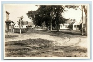 RPPC Unknown Early America Street Scene Trolley Train Tracks Storefront Postcard