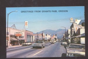 GREETINGS FROM GRANTS PASS OREGON OLD CARS STORES VINTAGE POSTCARD