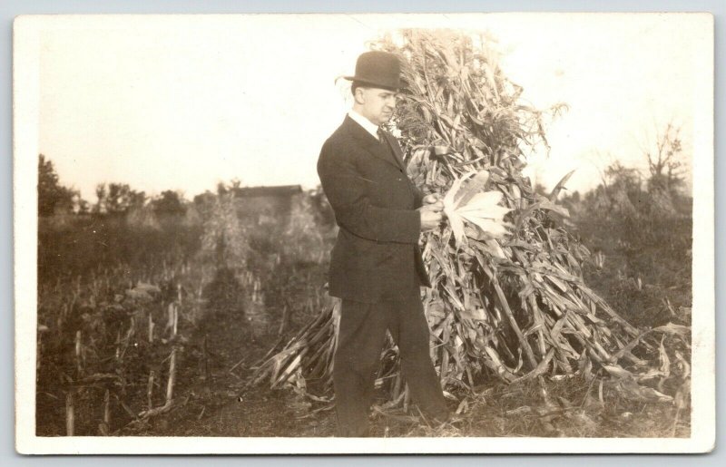 Real Photo Postcard~Businessman Examines Corn by Shuck Stack~Farm~c1912 RPPC
