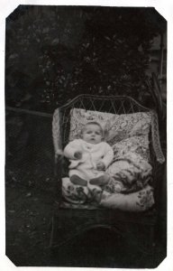 VINTAGE POSTCARD REAL PHOTO RPPC BABY WITHIN CUSHIONED CHAIR - ANONYMOUS c. 1920