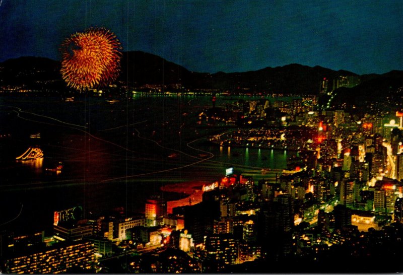 Hong Kong Eastern District By Night With Fireworks Over The Harbour