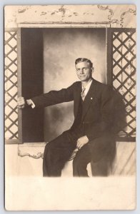 Minneapolis-St Paul~Man w/Side Part Hair Sits in Faux Studio Window~Kregel RPPC