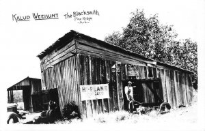 RPPC Kalup Weehunt THE BLACKSMITH Pine Ridge, AR Tobacco Sign Vintage Postcard