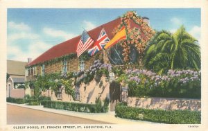 St Augustine Florida Oldest House St Francis St,  Flags,  Linen Postcard