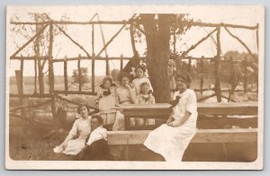 RPPC People in Park Rustic Bridge Rail Picnic Women Children Postcard E24