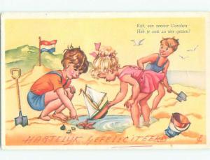 1963 foreign signed DUTCH KIDS PLAYING AT THE BEACH k6449