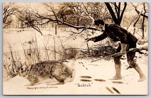 Cheyenne WY Publisher ME Mitchell~Hunter Pours Salt On Exaggerated Rabbit~RPPC