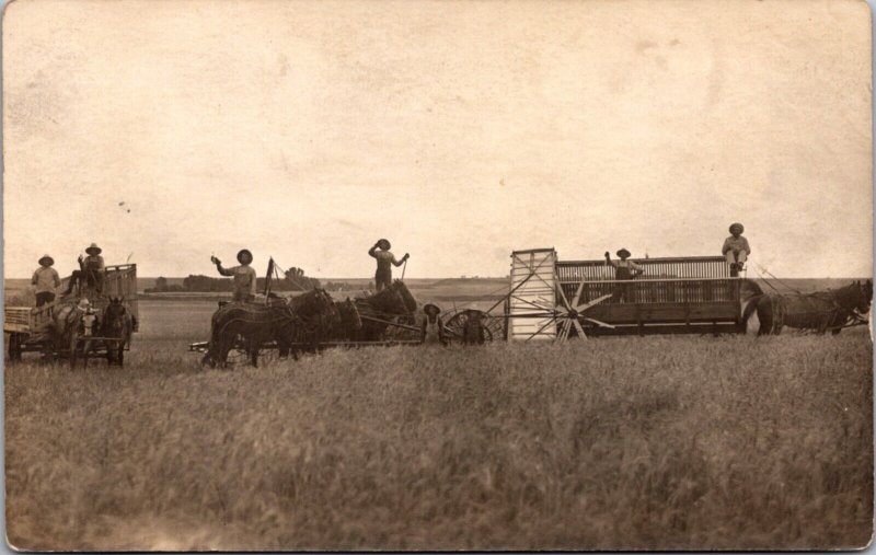 Real Photo Postcard Men Using Farming Equipment in a Field