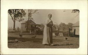 Older Woman in Yard w/ Chickens Old Car Barns c1910 Real Photo Postcard