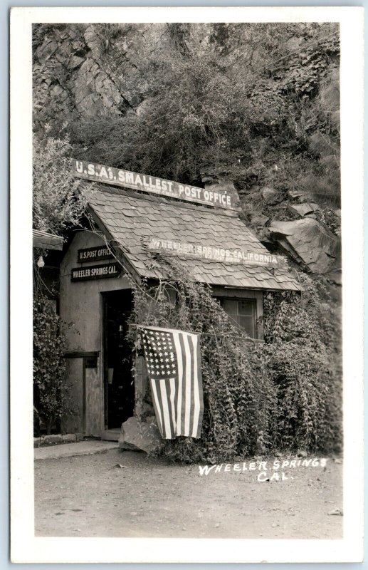 1939 Wheeler Springs CA RPPC Smallest Post Office Real Photo Flag Postcard A97