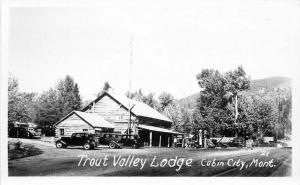 Autos Gas Station Trout Valley Lodge Cabin City Montana 1950s RPPC Postcard 5069 