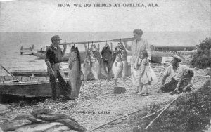 FISHING EXAGGERATION A MORNING CATCH AT OPELIKA ALABAMA POSTCARD 1921