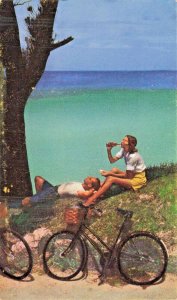 FLATTS BERMUDA~BICYCLE RIDERS REST BETWEEN FLATTS  & HAMILTON~POSTCARD