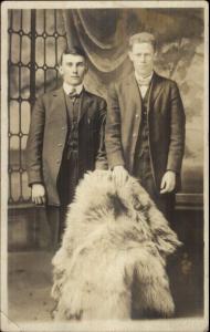 Men Holding Bear Fur Princeton WV Photo Studio on Back c1910 RPPC