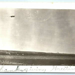 c1910s Farm Field Landscape Harvest Grain Piles RPPC Real Photo Church A30