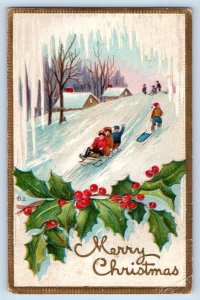 Christmas Postcard Holly Berries Childrens Sledding Winter Embossed Nash c1910's
