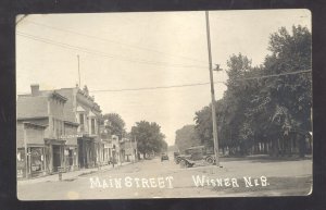 RPPC WISNER NEBRASKA DOWNTOWN MAIN STREET SCENE STORES CARS REAL PHOTO POSTCARD